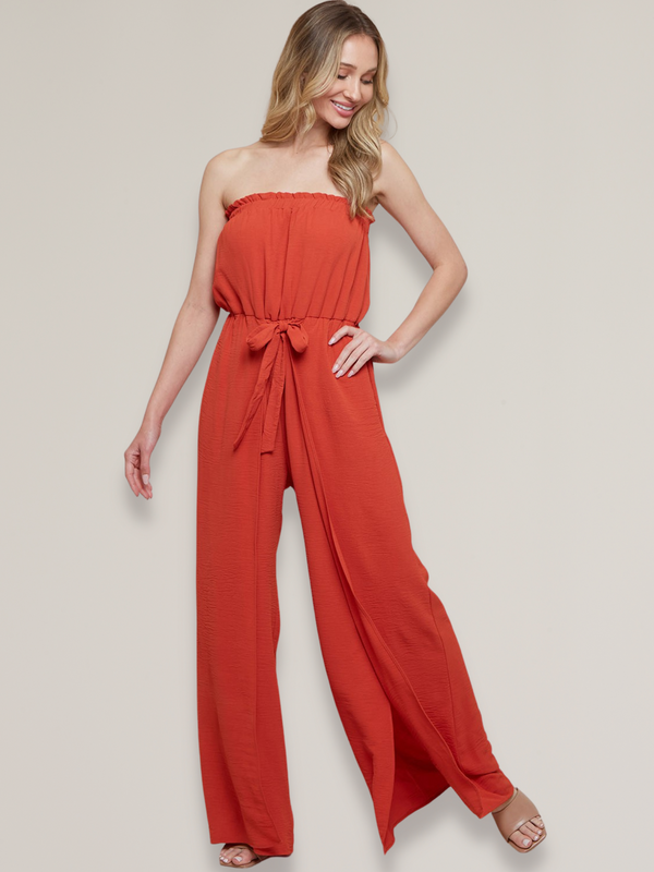 women's strapless jumpsuit with side slit at leg in red