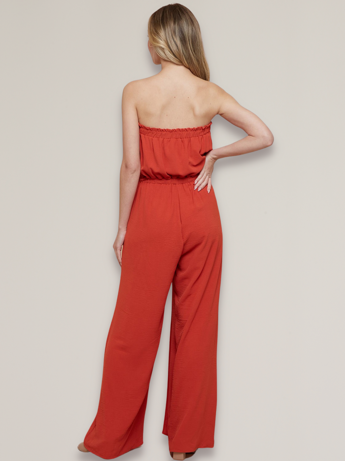 women's strapless jumpsuit with side slit at leg in red