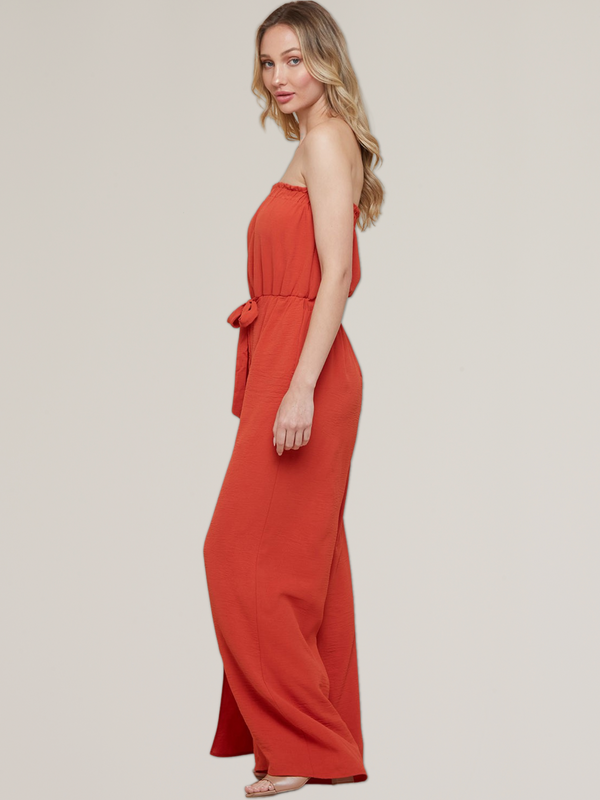 women's strapless jumpsuit with side slit at leg in red