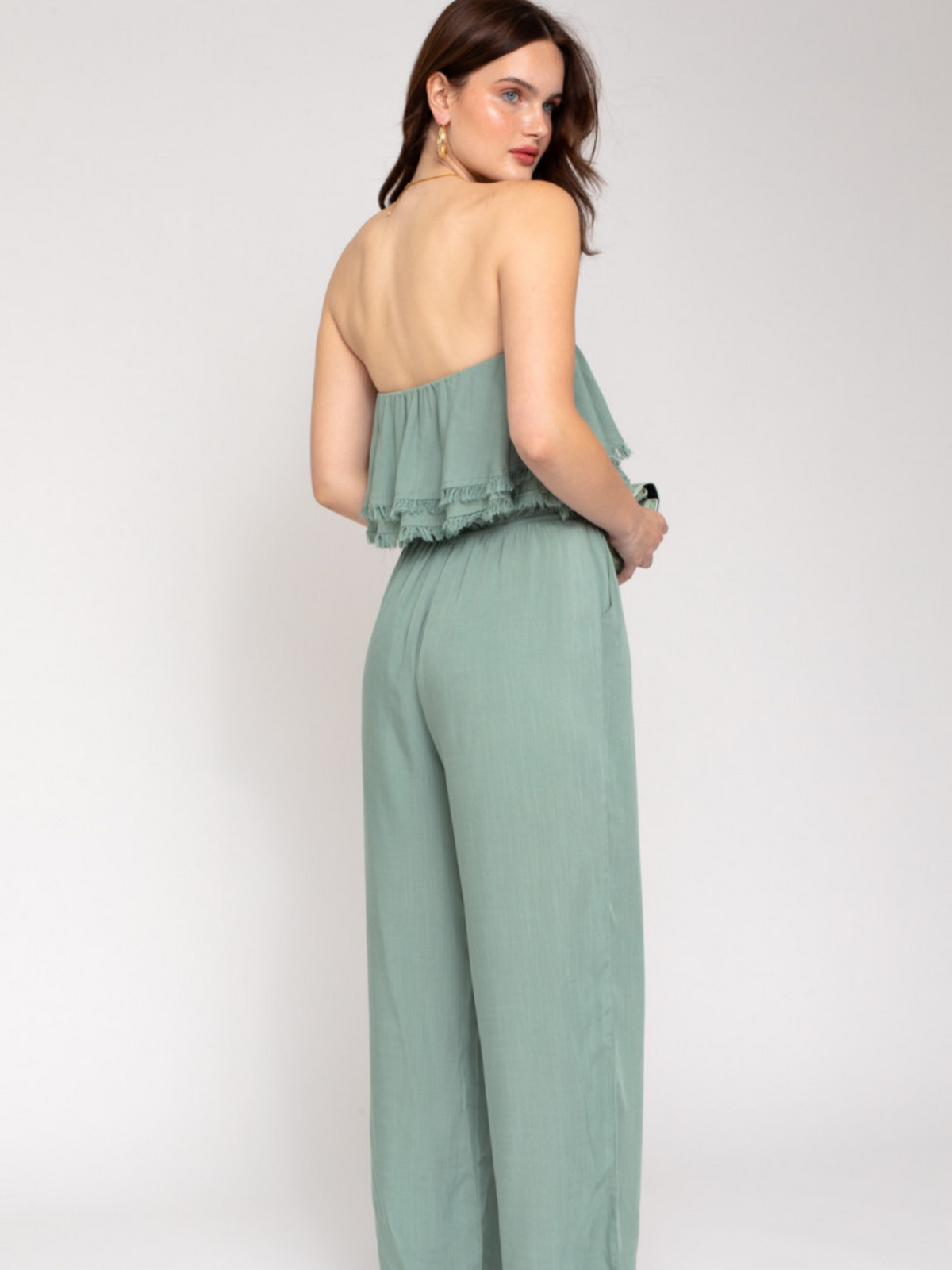 women's tube top jumpsuit with frayed hem. color sage. 